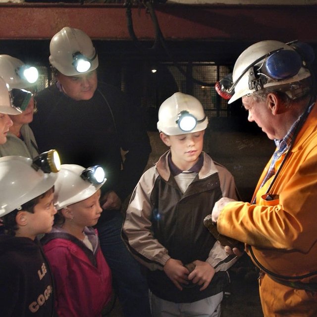 Crowd of visitors in coal mine